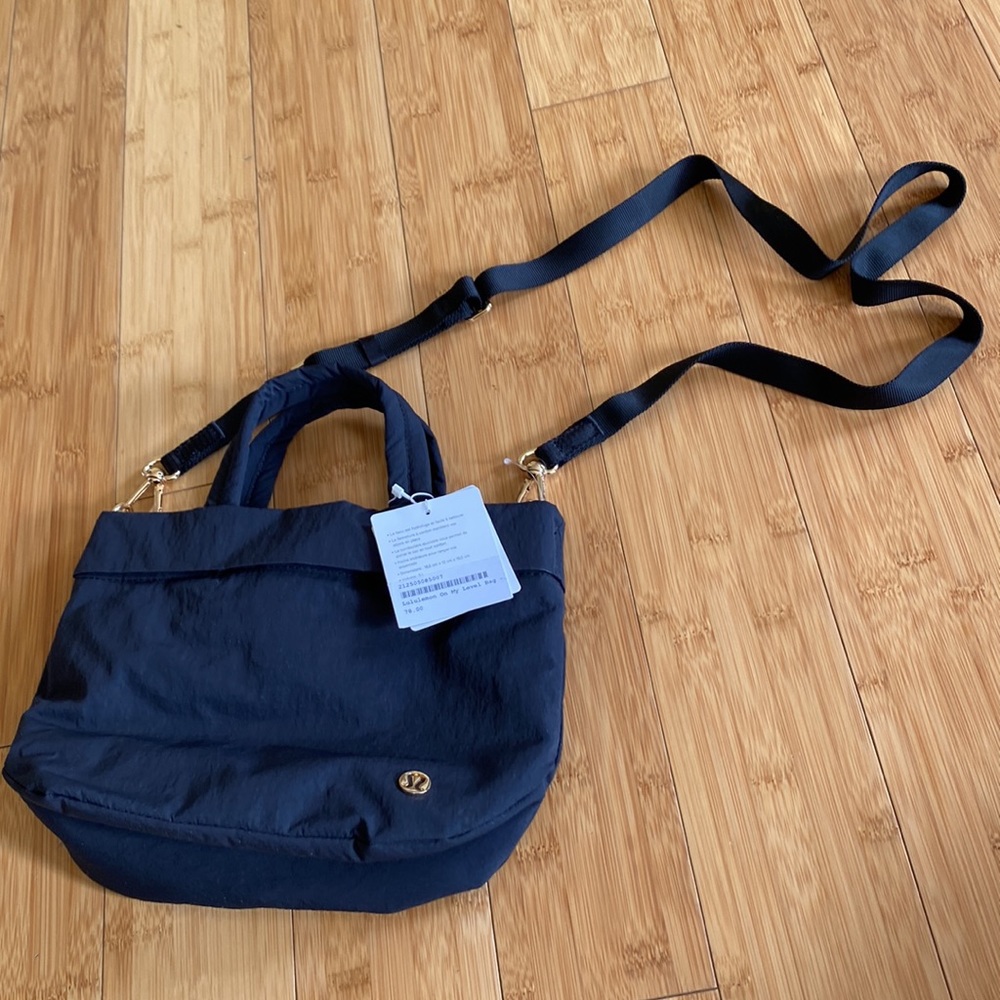 Lululemon on my level micr bag. Black. New with tags